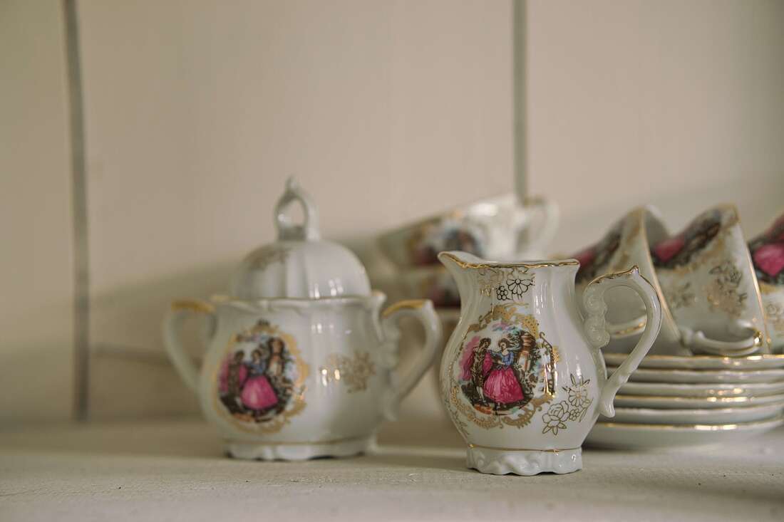 China tea set with victorian women pink dress.