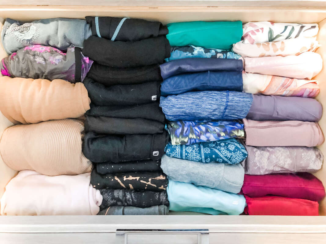 Vertically folded drawer of workout leggings.