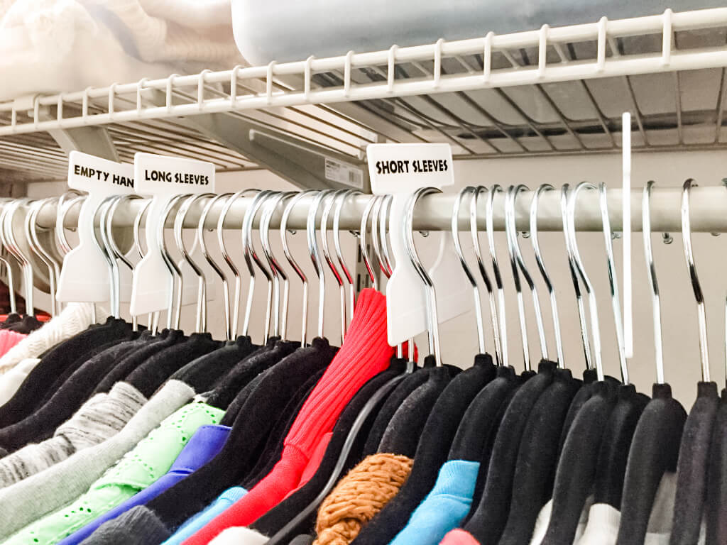 Labeled sections of clothing using over the rod dividers, done by Hello Simplified in a Portsmouth, NH home