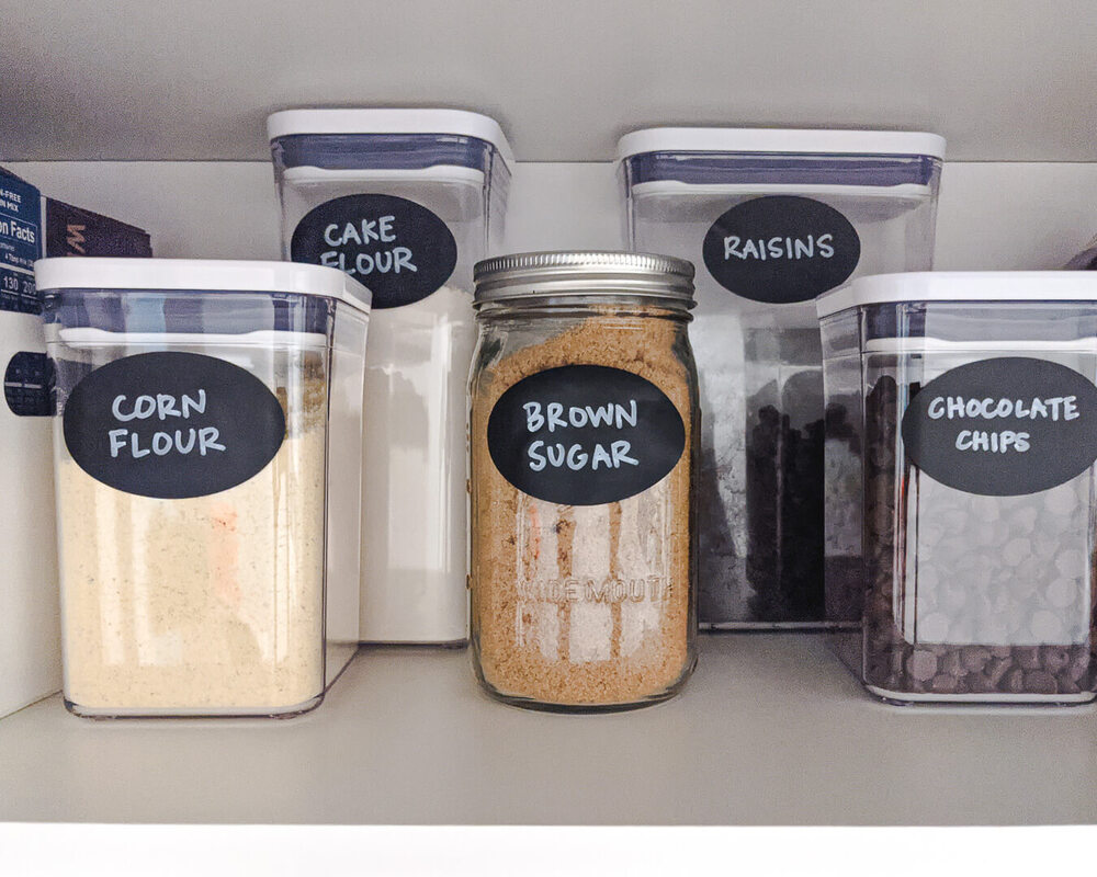 Baking supplies in Oxo Pop Containers with chalkboard labels.