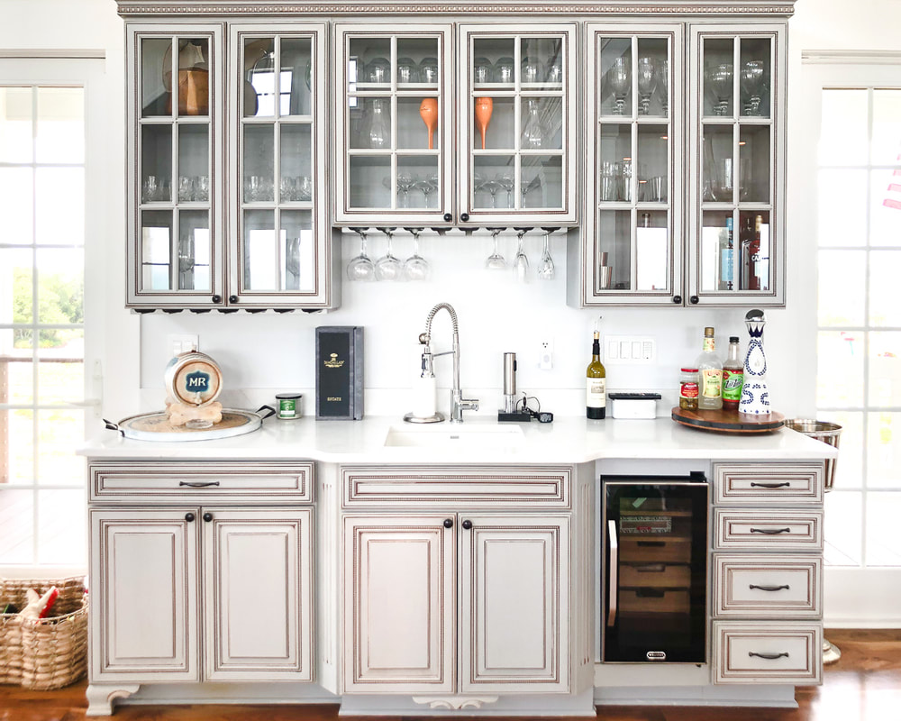 Gray wet bar with organized glasses