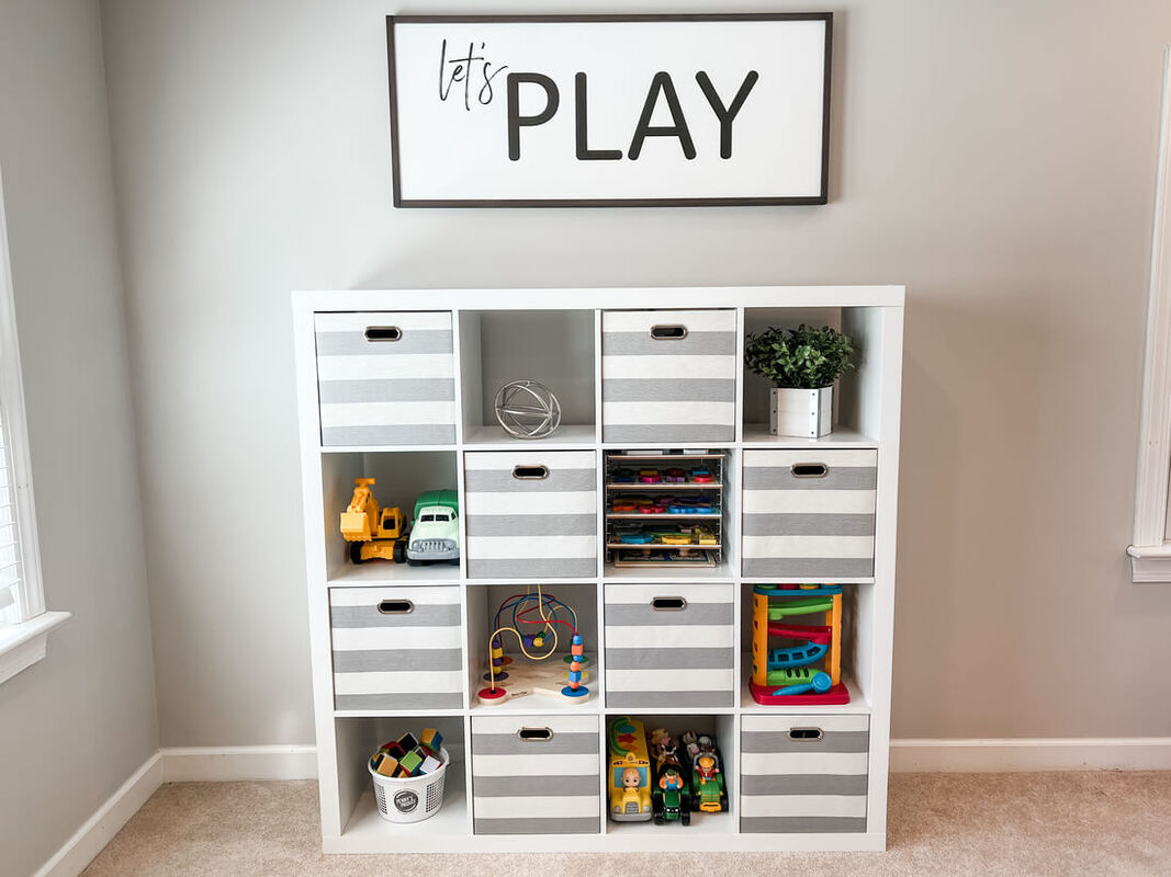 playroom cube shelfs with let's play sign