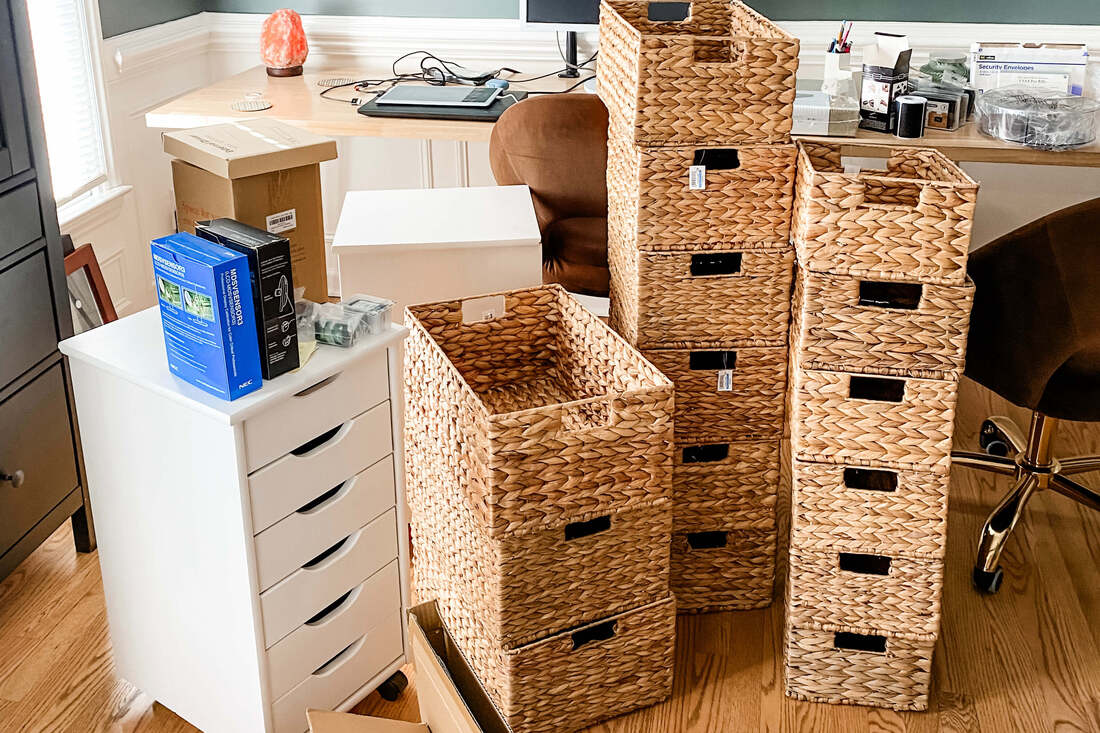 Baskets stacked on office floor organizing products